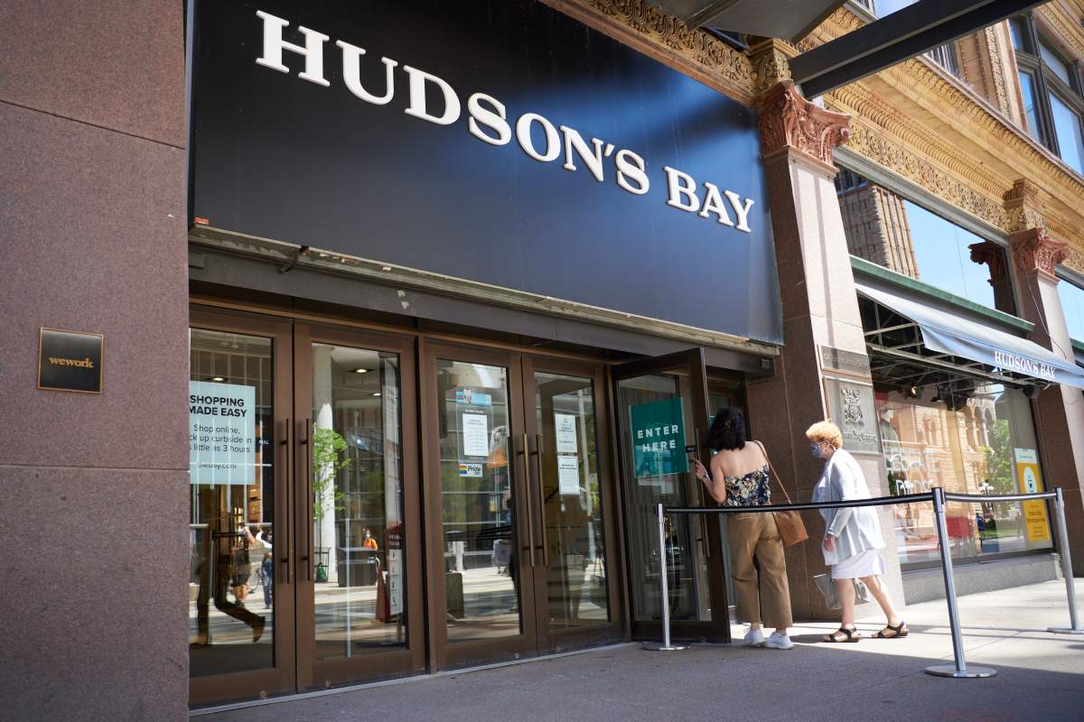People shop in-store at Hudson’s Bay at CF Toronto Eaton Centre in Toronto on June 15, 2021.