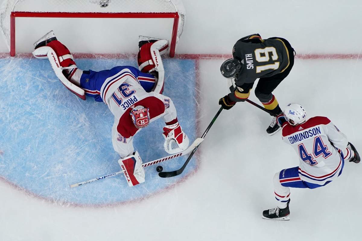 Montreal Canadiens goaltender Carey Price (31) blocks a shot by Vegas Golden Knights right wing Reilly Smith (19) during the third period in Game 5 of an NHL hockey Stanley Cup semifinal playoff series Tuesday, June 22, 2021, in Las Vegas. (AP Photo/John Locher)