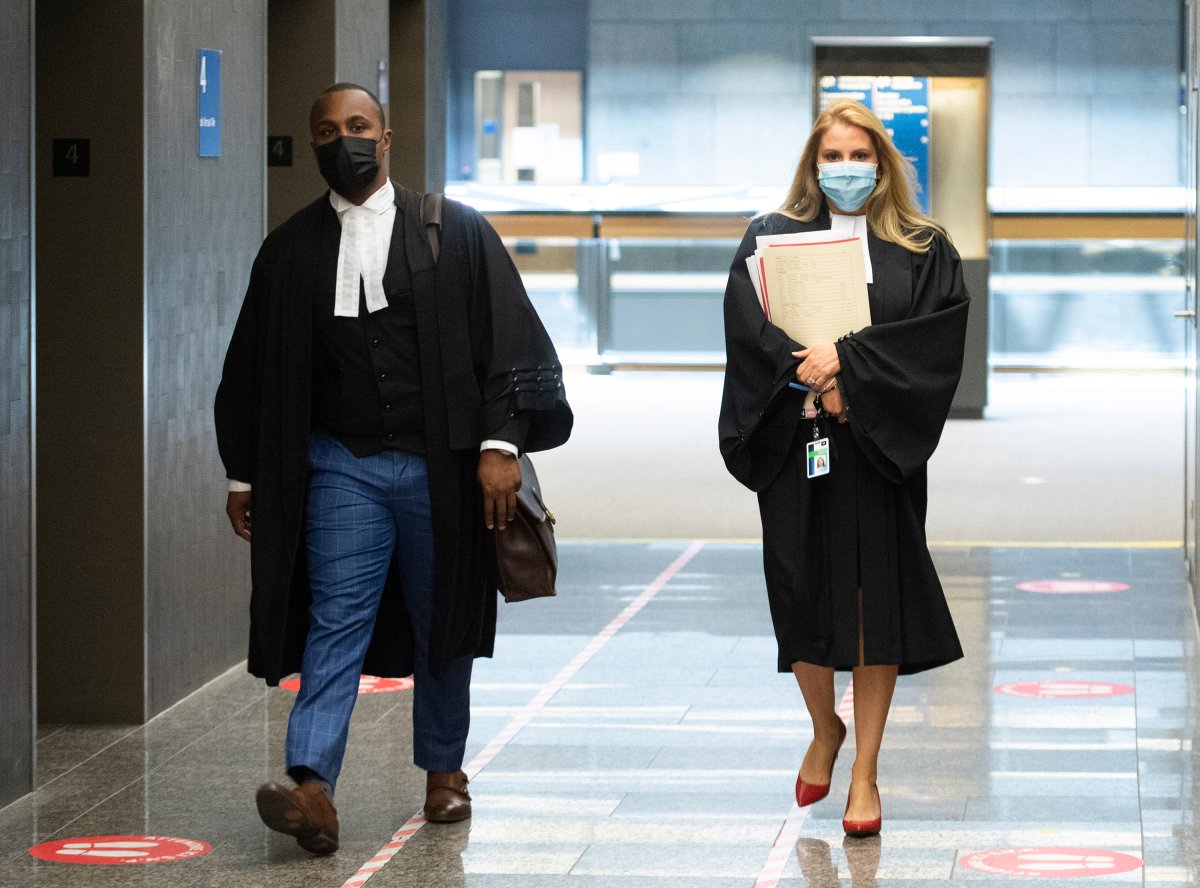 Annabelle Sheppard, right, crown prosecutor for the case against Luc Wiseman, and Wiseman’s lawyer Alexandre Bien-Aime arrive at the courthouse in Montreal, Wednesday, June 23, 2021.
