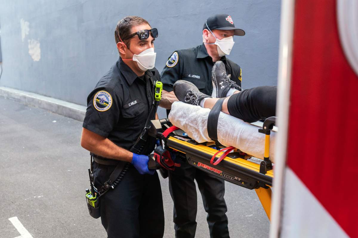 Paramedics Cody Miller, left, and Justin Jones respond to a heat exposure call during a heat wave, Saturday, June 26, 2021, in Salem, Ore.