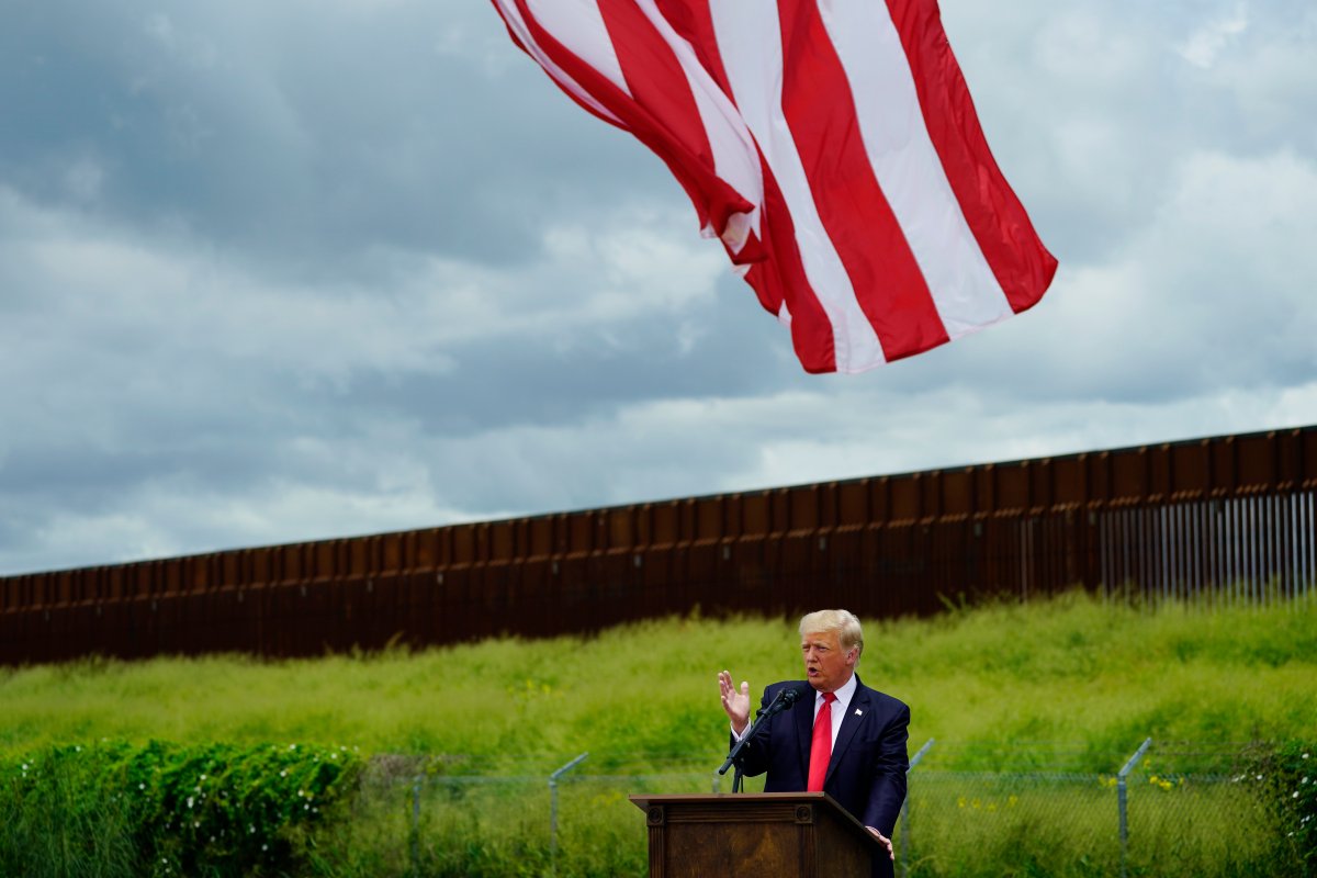 Former President Donald Trump speaks during a visit to an unfinished section of border wall with Texas Gov. Greg Abbott, in Pharr, Texas, Wednesday, June 30, 2021.