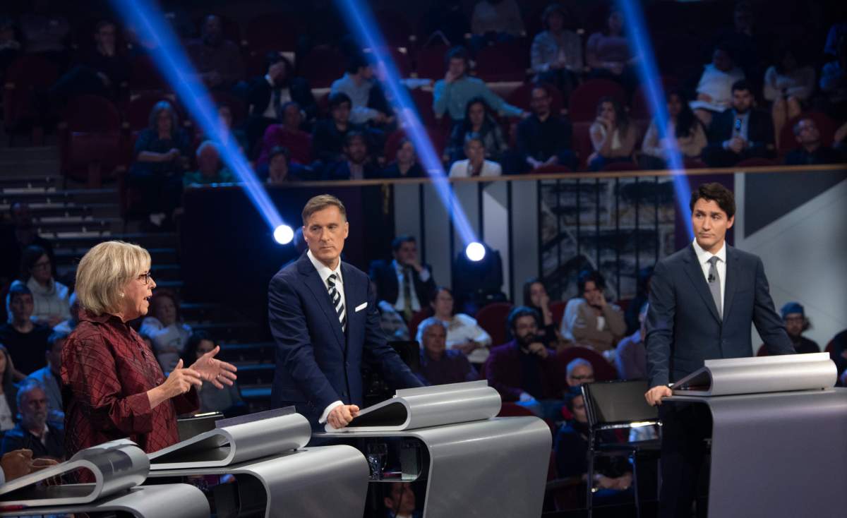Green Party leader Elizabeth May, left to right, People's Party of Canada leader Maxime Bernier, and Liberal leader Justin Trudeau takes part in the the Federal leaders French language debate in Gatineau, Que. on Thursday, October 10, 2019. 
