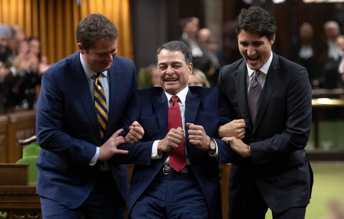 Prime Minister Justin Trudeau and Leader of the Opposition Andrew Scheer jokingly drag Liberal MP Anthony Rota to the Speaker’s chair after he was elected as the new Speaker of the House of Commons, in Ottawa, Thursday, Dec. 5, 2019 in Ottawa. THE CANADIAN PRESS/Adrian Wyld