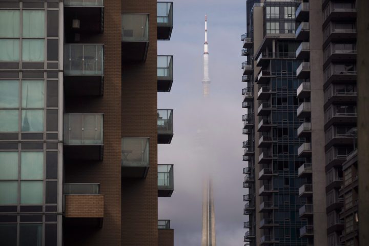 The CN Tower can be seen behind condos in Toronto's Liberty Village community in Toronto on Tuesday, April 25, 2017.