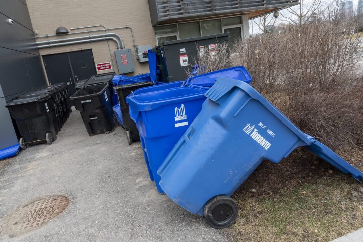 Emptied garbage and recycling bins left open at the Edithvale Community Centre in North York, Ont. on March 14, 2020.