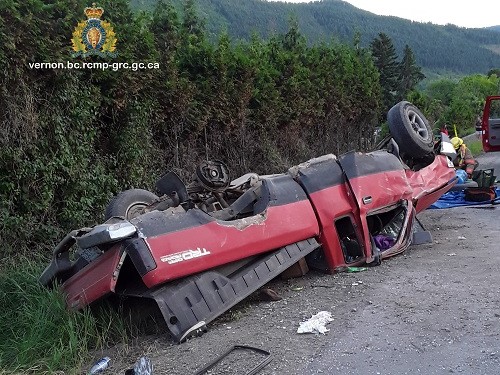Two trapped people were extricated from this overturned pickup truck along Highway 6 near Lavington on Thursday evening. 