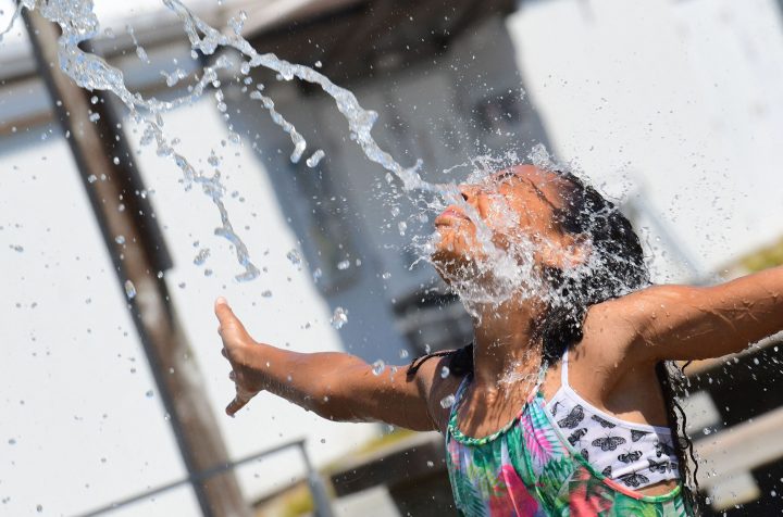 Kids cool off at a community water park on a scorching hot day in Richmond, British Columbia, June 29, 2021.