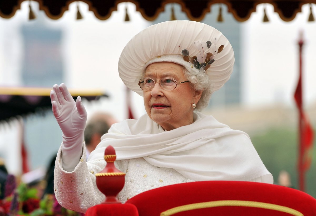 Britain’s Queen Elizabeth II waves from the royal barge Spirit of Chartwell as it sails past the Houses of Parliament during the Thames Diamond Jubilee Pageant on the River Thames in London on June 3, 2012.