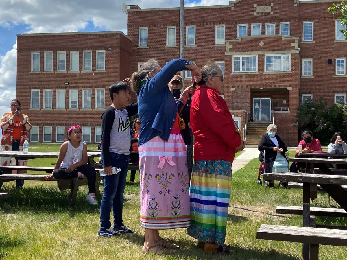 Siksika Nation women who attended residential schools cut their braids on Sunday, June 6, 2021, in memory of the 215 children whose bodies were found in unmarked burial sites in Kamloops.