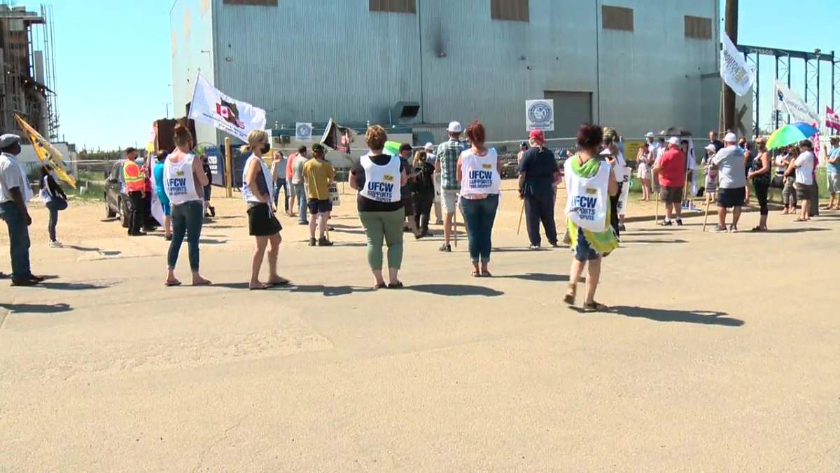 Picketers outside CESSCO Fabrication and Engineering Ltd. on June 28, 2021