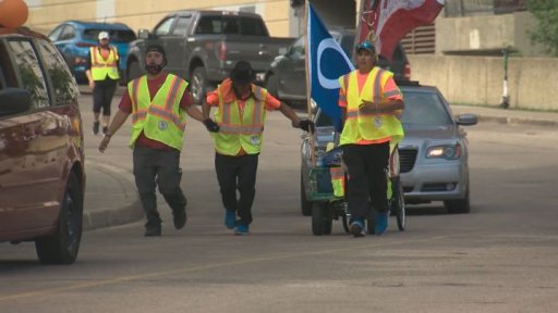 Adam McDonald (right) and Stanley Gilbert Jean (centre) arrived in Edmonton on Monday to a warm reception organized for them near the Alberta legislature. The are walking from Fort McMurray Alta., to Ottawa to raise awareness about missing and murdered Indigenous women and girls.