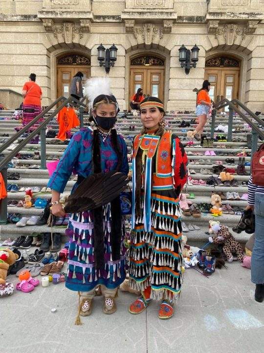 Meadow Musqua (left) danced at the Saskatchewan Legislative Building during a ceremony honouring the remains of 215 children found at a former Kamloops residential school.