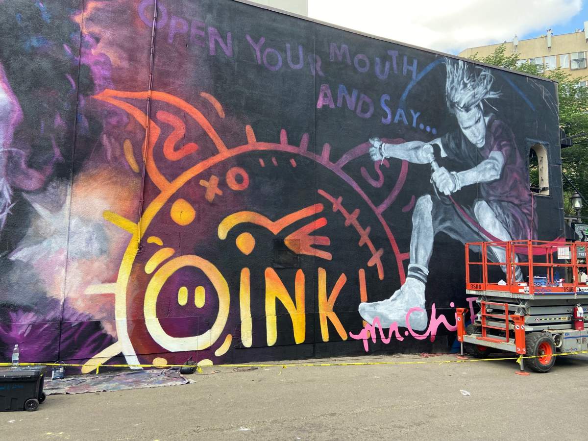 A mural of SNFU’s front man Chi Pig is being painted on the side of The Buckingham on Whyte Ave in Edmonton, June 24, 2021.