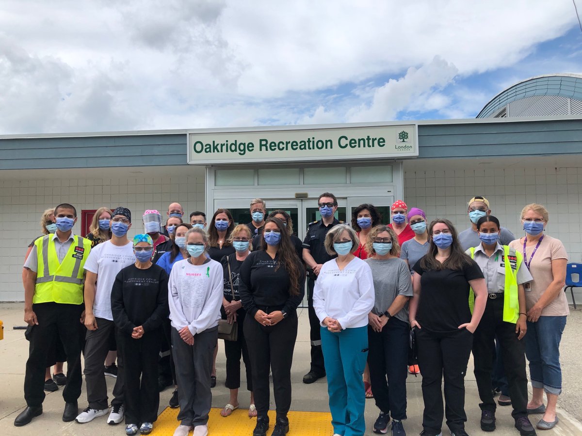 Staff stand outside of the Oakridge COVID-19 assessment centre on June 30, 2021.