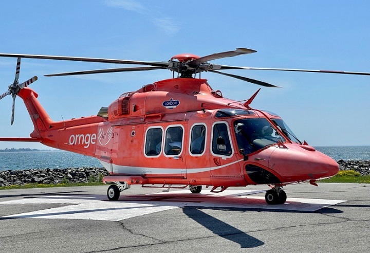 An Ornge air ambulance prepares to take off from the helipad outside Kingston General Hospital.