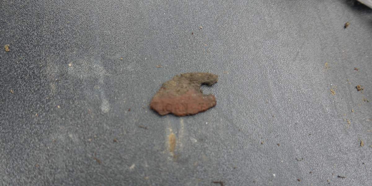 Fragment of identity disc recovered from grave. Courtesy: Andreas Metzmacher