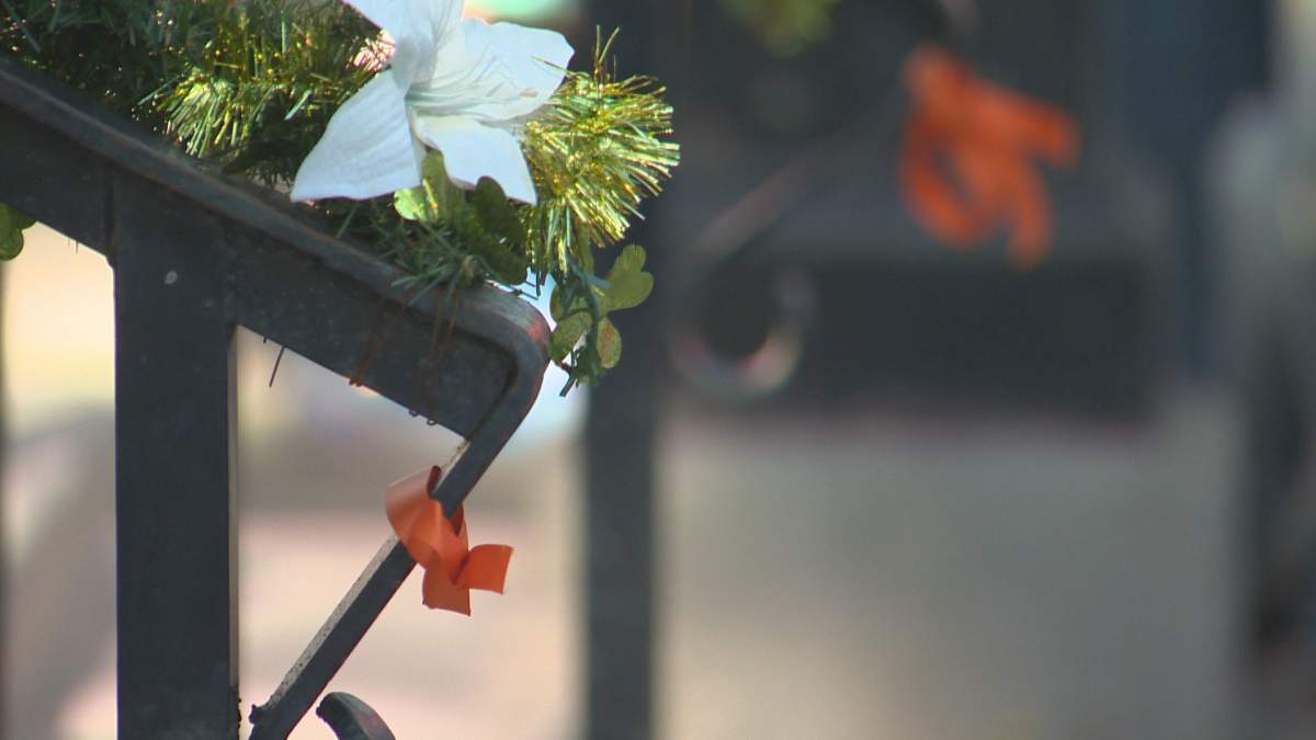 Orange ribbons honouring the children found in unmarked burial sites at Kamloops Indian Residential School at a vigil in Lethbridge, Alta., Monday, May 31, 2021.