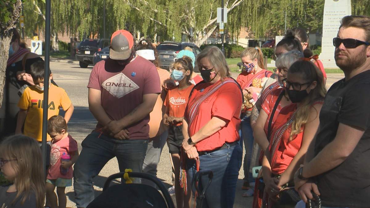 People gather for a vigil to honour victims of residential schools in Lethbridge, Alta., Monday, May 31, 2021.