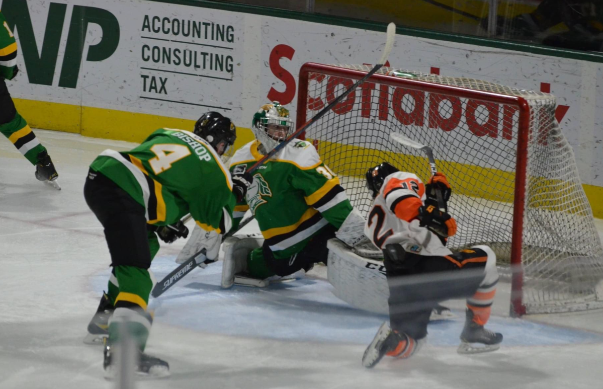 Elgin-Middlesex forward Noah Vandenbrink scores a goal against the Junior Knights during a scout showcase at Budweiser Gardens.