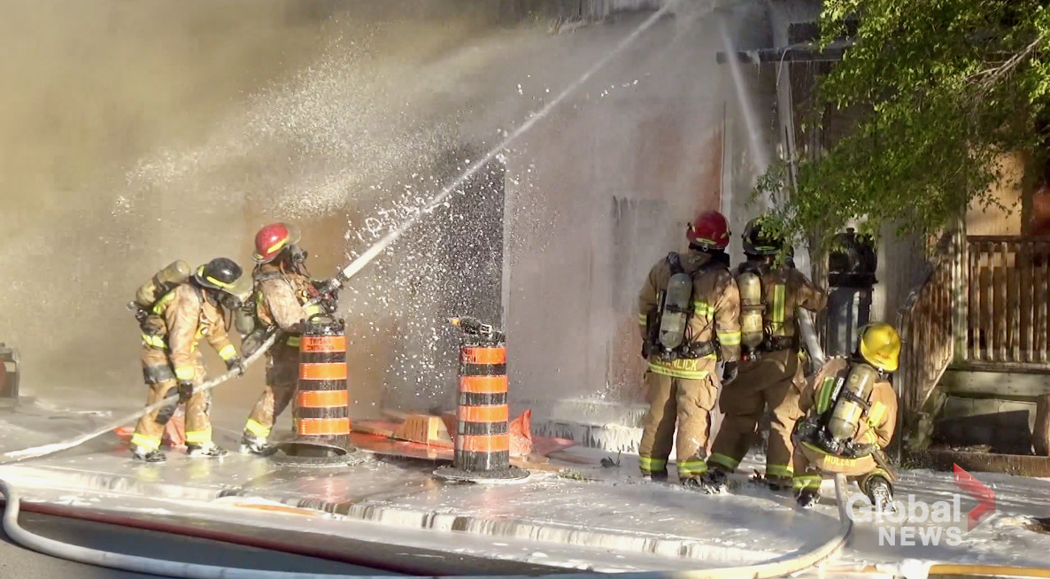 Firefighters battle the house fire at the corner of Stewart and Dalhousie streets in Peterborough on June 19, 2021.