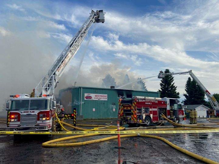 Firefighters work on a fire at the Westridge Curling Club in Stony Plain, Alta., on June 23, 2021.