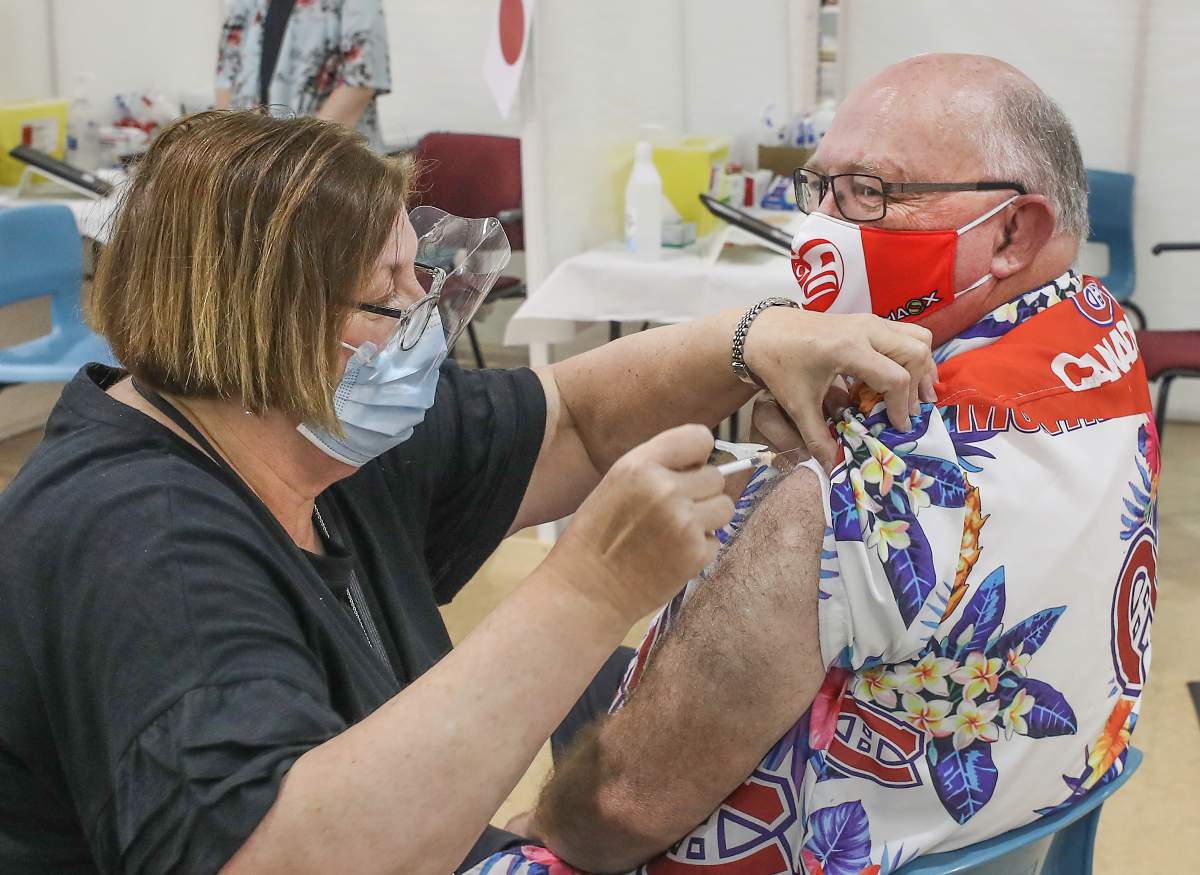 Dr. Robert Strang, the province\’s chief medical officer of health, receives his second dose of a COVID-19 vaccine on June 28, 2021.