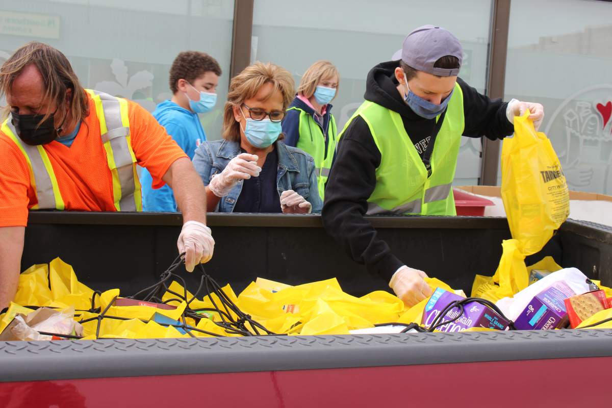 Volunteers collect food donations for the 2021 Target Hunger campaign in Lethbridge.
