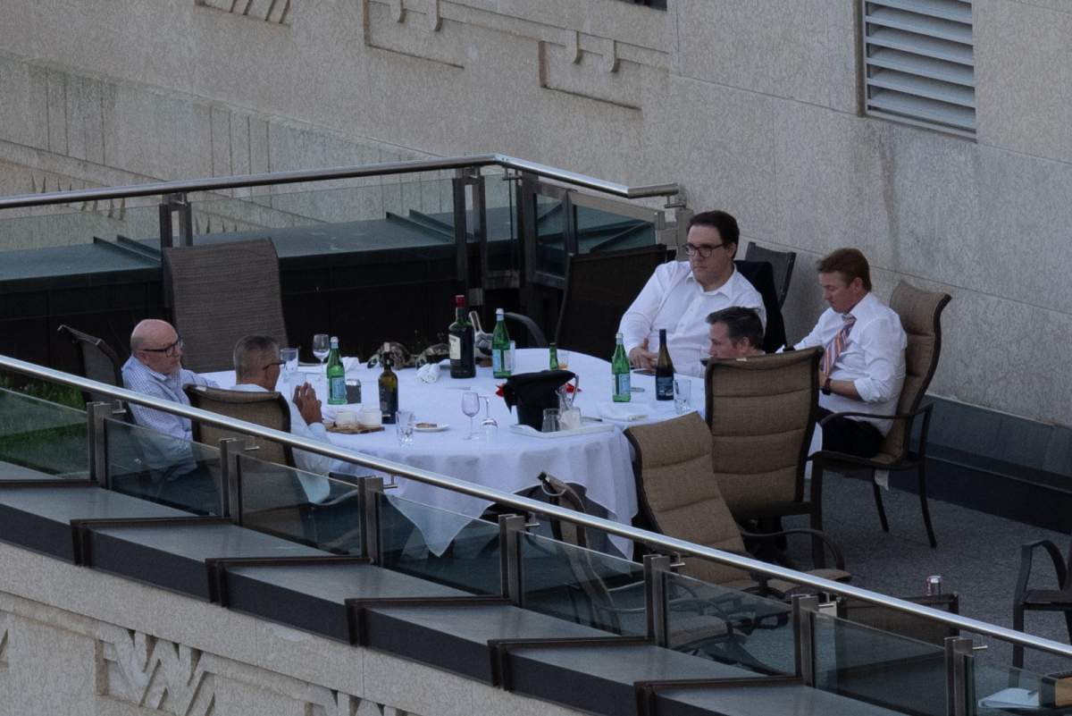 Premier Jason Kenney, ministers Tyler Shandro and Jason Nixon, as well as UCP staff members seen in a “working dinner” on the balcony of the “sky palace” in Edmonton on Tuesday, June 1.