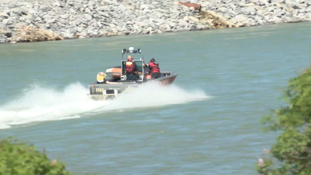 The Calgary Fire Department's water rescue team rescuing rafters on the Bow River on Thursday, June 17. 