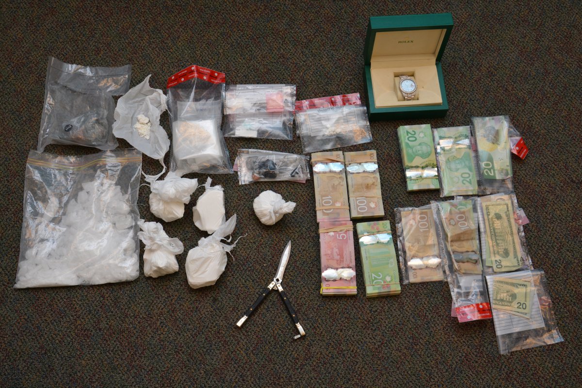 Police say they found cocaine, crystal methamphetamine, fentanyl, cash and a butterfly knife in a Brockville apartment following the arrests of two Ottawa men.