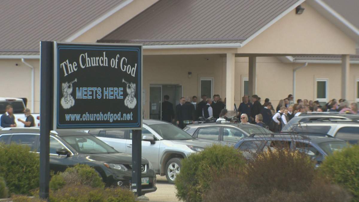Crowds gather at the church near Steinbach despite public health orders.
