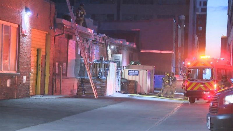 Calgary firefighters investigate a dumpster fire on Thursday, June 3, 2021. 