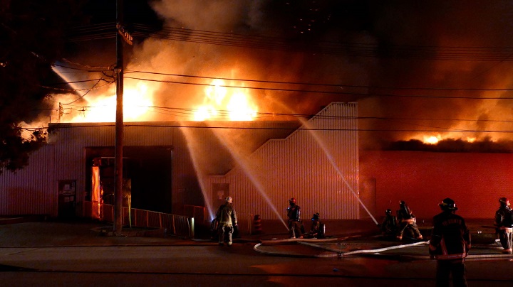Firefighters on scene of a 5-alarm fire on Bering Avenue in Etobicoke.