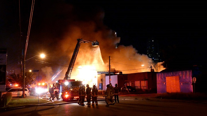 Firefighters on scene of a 5-alarm fire on Bering Avenue in Etobicoke.