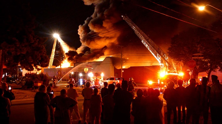 Firefighters on scene of a 5-alarm fire on Bering Avenue in Etobicoke.