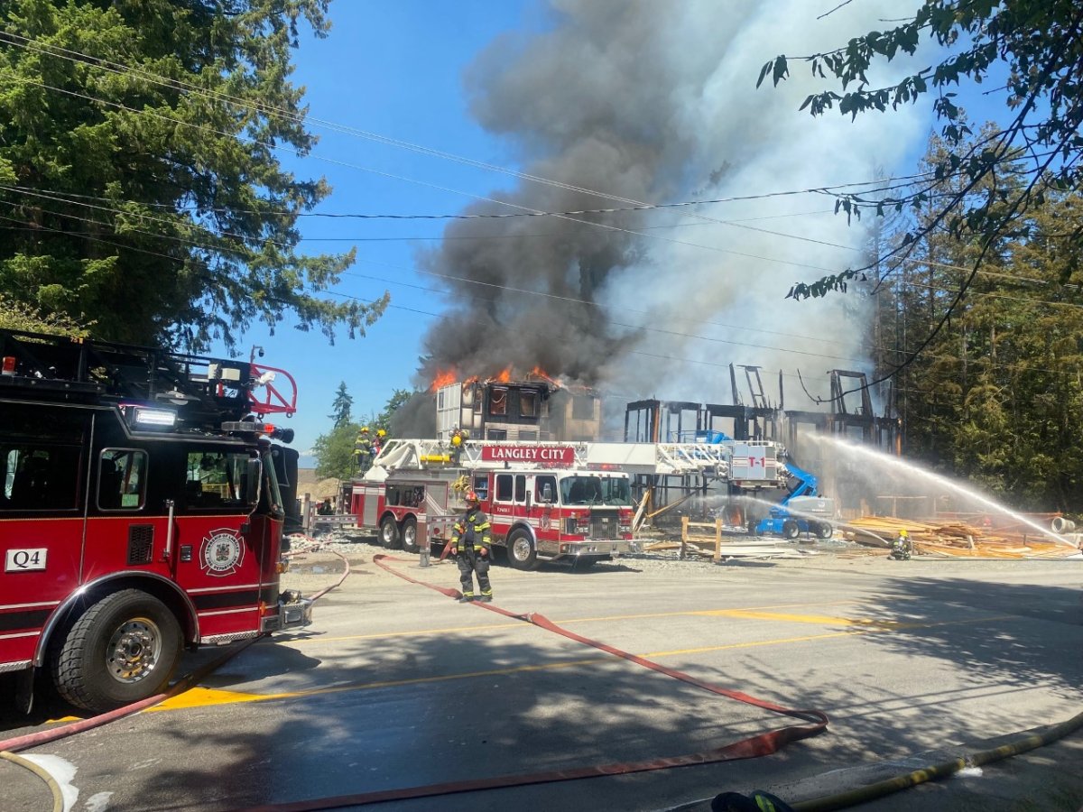 Crews battle a structure fire in Langley Township on Saturday.