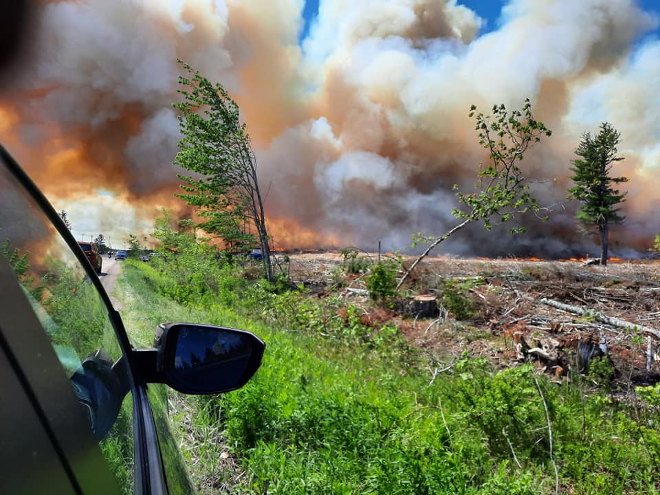 Gabriel Poirier, who was driving through the forest fire in New Brunswick\’s Kent County with his mother and great-grandmother, said it looked “like hell.”