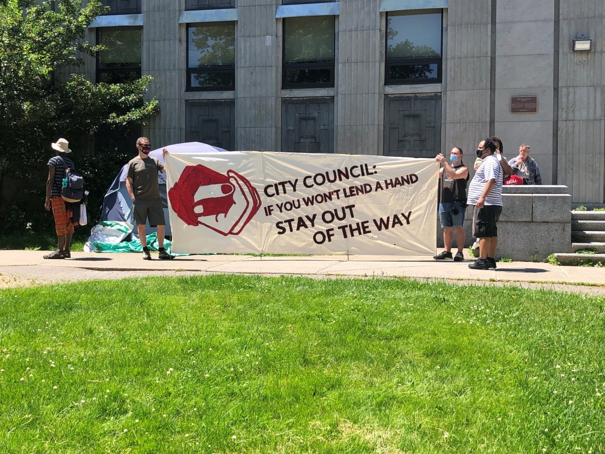 A demonstration was held Sunday afternoon in downtown Halifax amid claims that the municipality is offering residents of emergency shed-type shelters two weeks in a hotel in return for leaving their shelters so they can be demolished. 