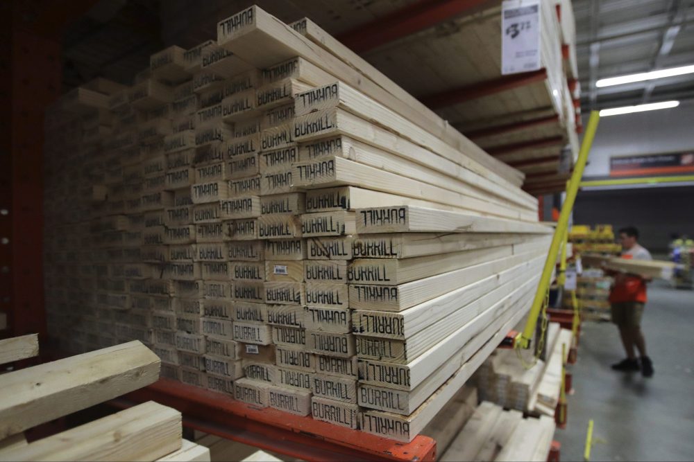 In this July 11, 2019, file photo, lumber is stacked at a Home Depot store in Londonderry, N.H. 