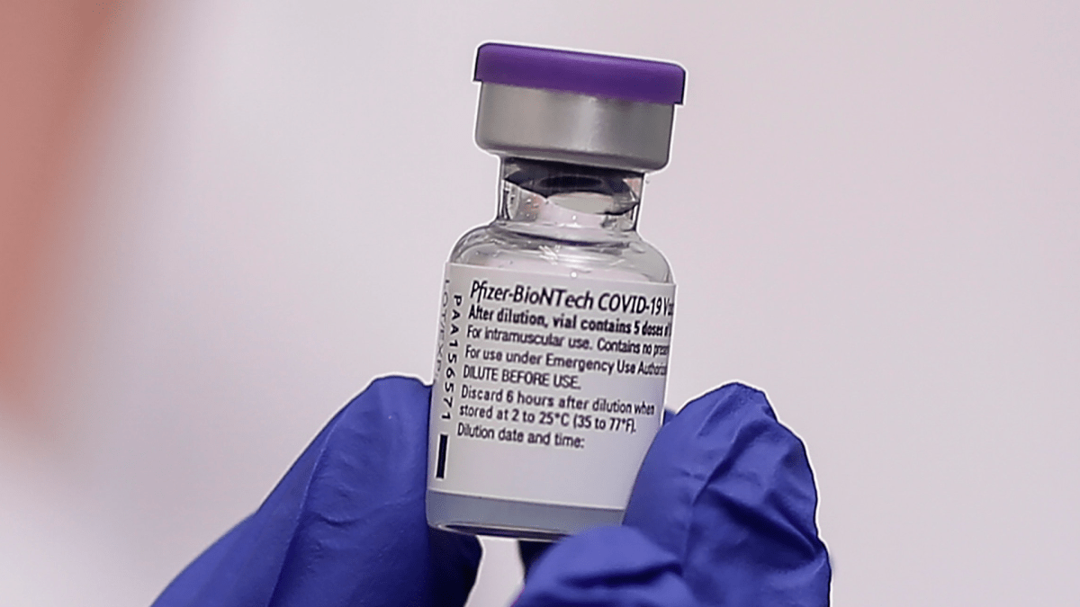 A nurse holds a dose of the Pfizer-BioNTech vaccine against the COVID-19, in Athens, Sunday, Dec. 27, 2020.