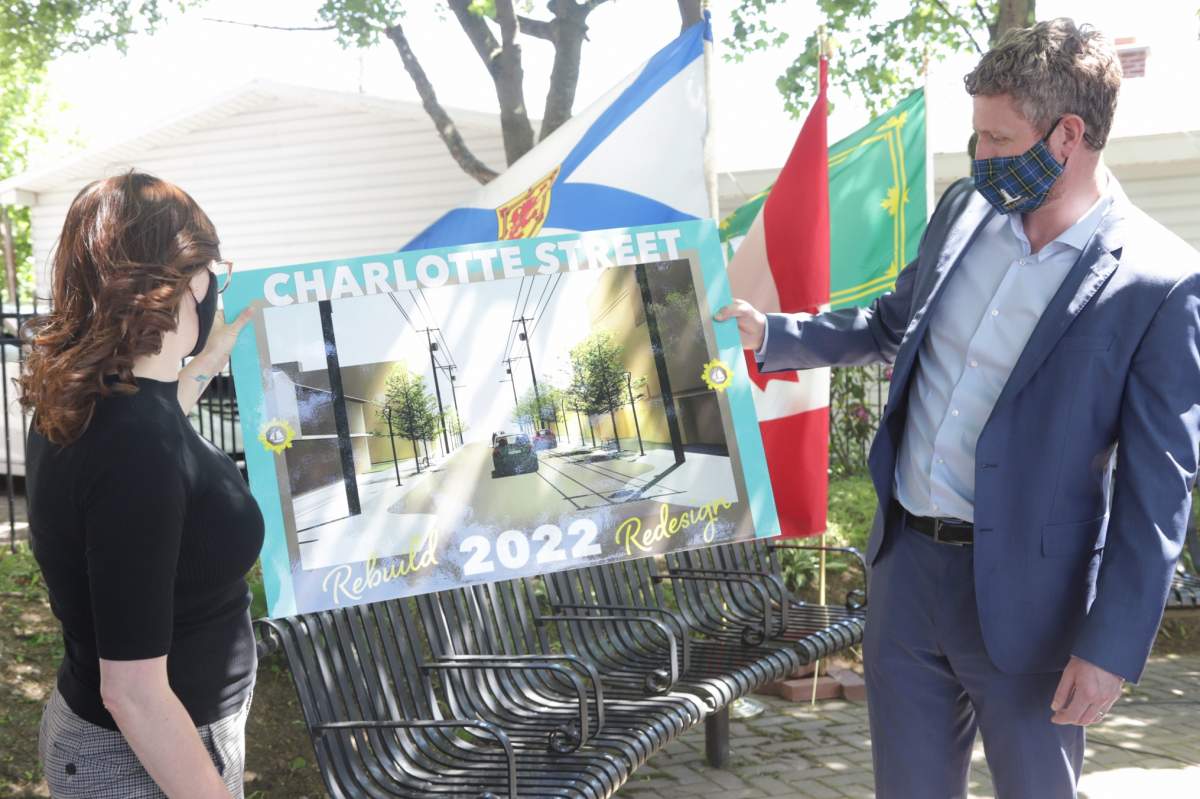 Premier Iain Rankin and CBRM Mayor Amanda McDougall unveil the rendering of the Charlotte Street project in Sydney.