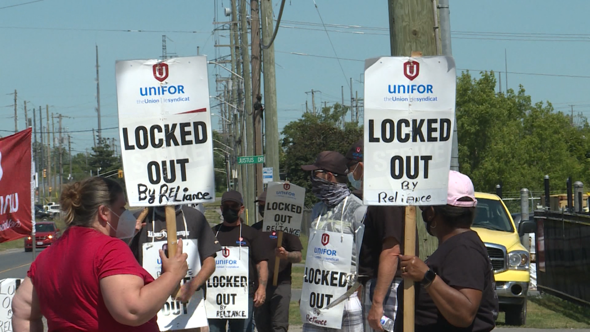 Locked-out Reliance workers picket outside its Kingston location.