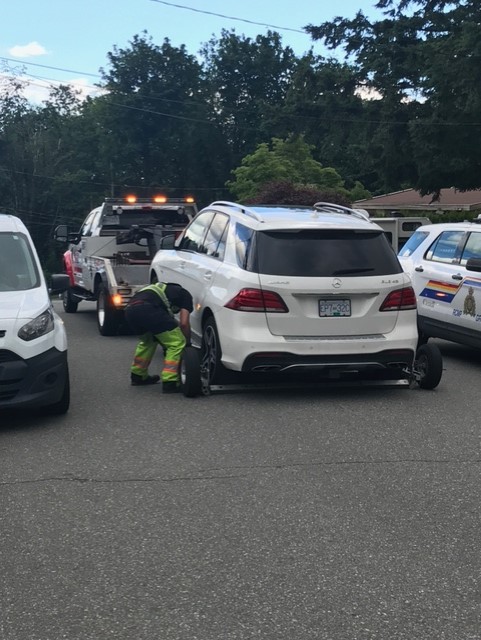 Police remove a vehicle belonging to Trina Hunt from a Mission property.