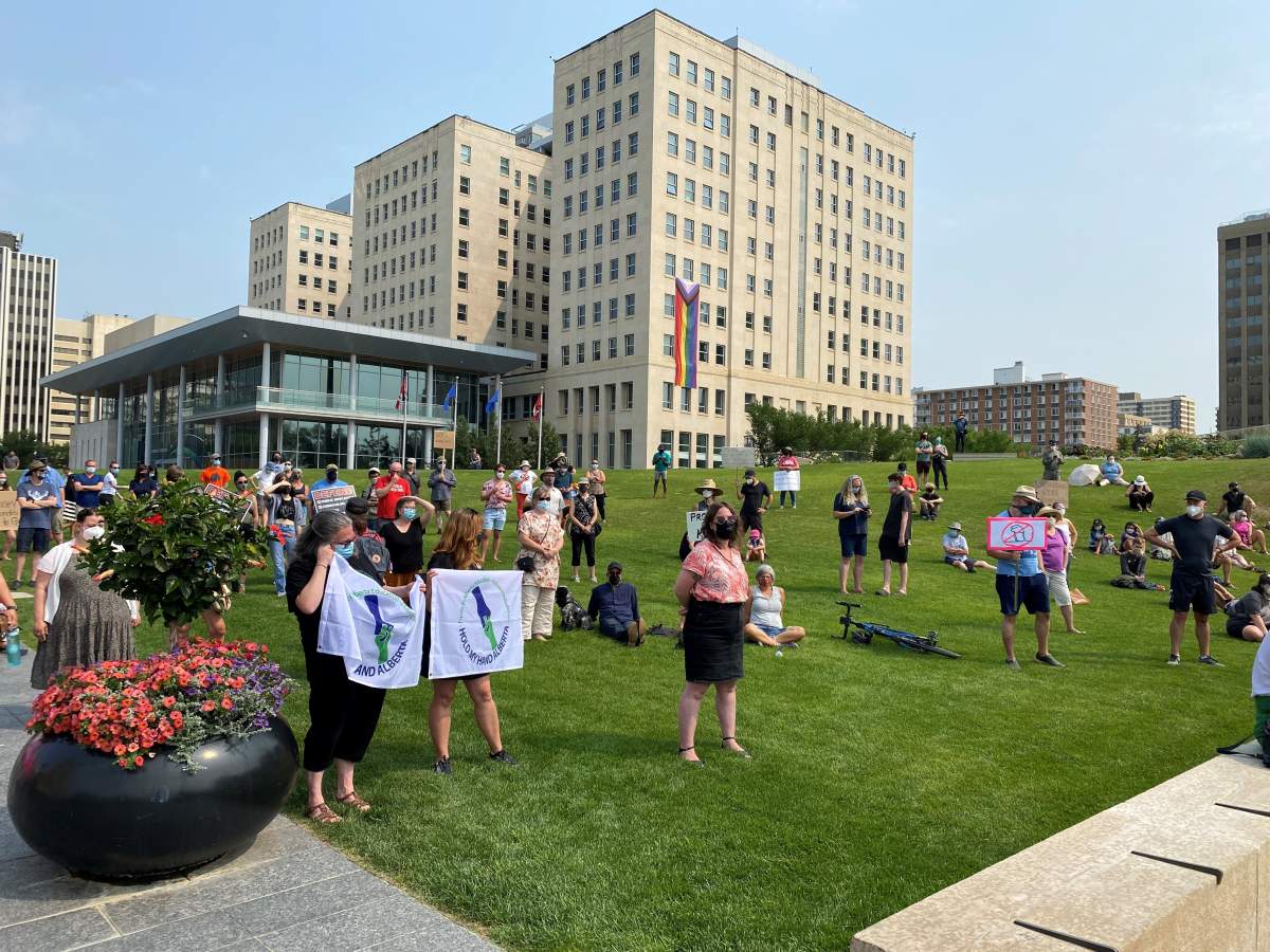 A rally at the Alberta legislature opposing the government’s plans to lift COVID-19 isolation requirements, masking rules and change testing. July 30, 2021.