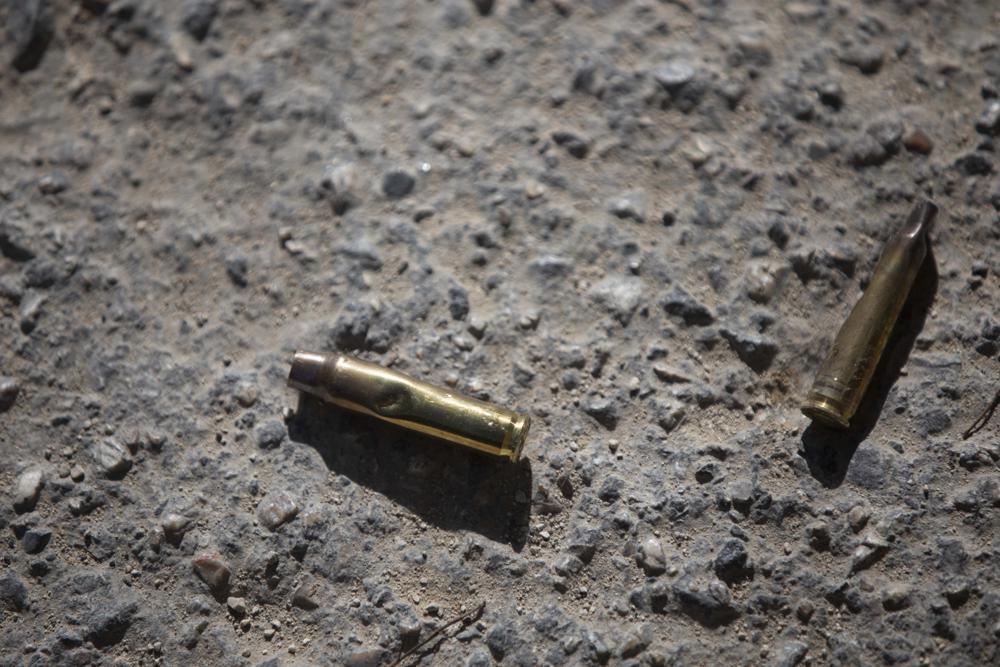Ammunition casings lay on the ground near the entrance to the house of late Haitian President Jovenel Moise in Port-au-Prince, Haiti, Wednesday, July 7, 2021.