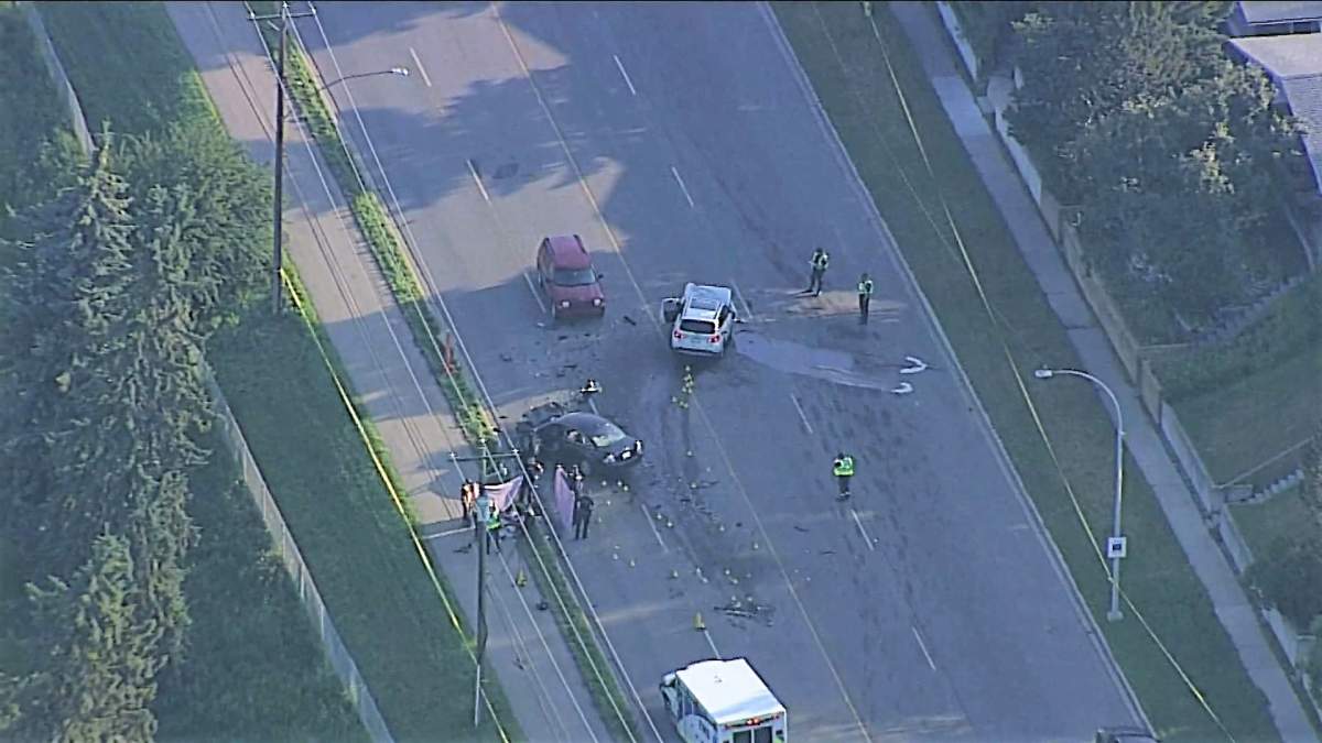 Calgary police investigate a fatal two-vehicle crash on 14 Street Northwest on Friday, July 9, 2021.