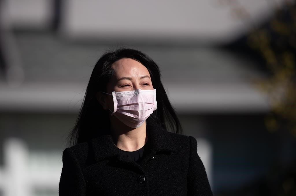 Meng Wanzhou, chief financial officer of Huawei, leaves her home to attend a hearing at B.C. Supreme Court, in Vancouver, on March 29, 2021. THE CANADIAN PRESS/Darryl Dyck.