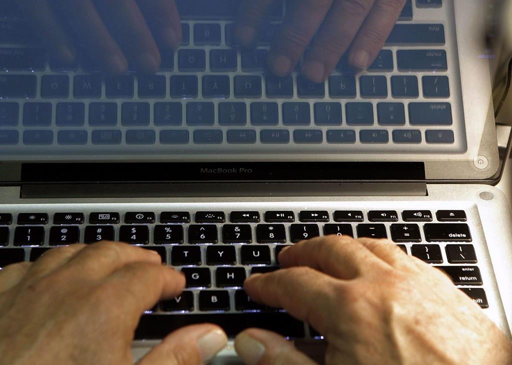 Hands type on a computer keyboard in Los Angeles on Feb. 27, 2013. A program in Durham Region, Ont., aims to alert kids to human trafficking to prevent them from being victimized. THE CANADIAN PRESS/AP, Damian Dovarganes.