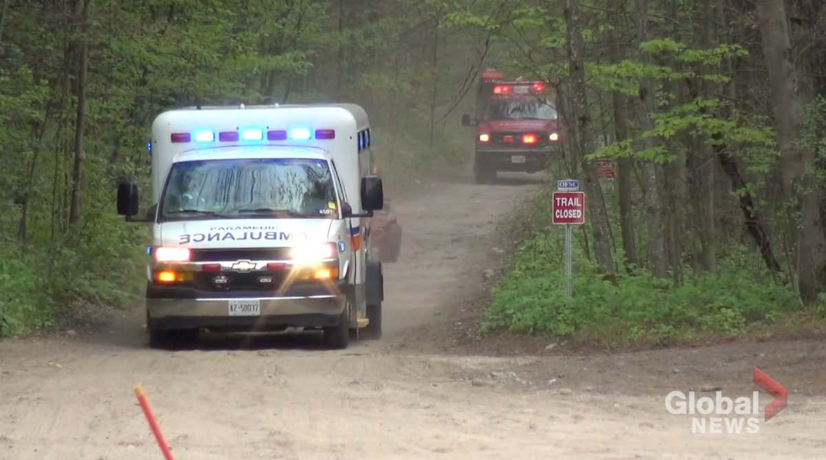 Paramedics carry an injured woman from the Ganraska Forest following an ATV crash in 2021.