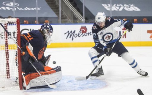 Edmonton Oilers goalie Mike Smith (41) makes the save on Winnipeg Jets’ Mason Appleton (22) during first period NHL Stanley Cup playoff action in Edmonton on Friday, May 21, 2021.
